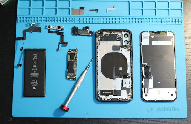 iPhone parts laid out for repair
